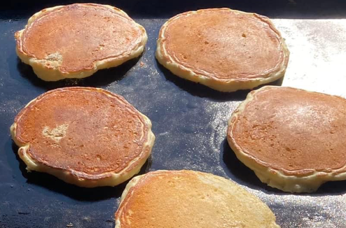 Pancakes on a griddle on the grill