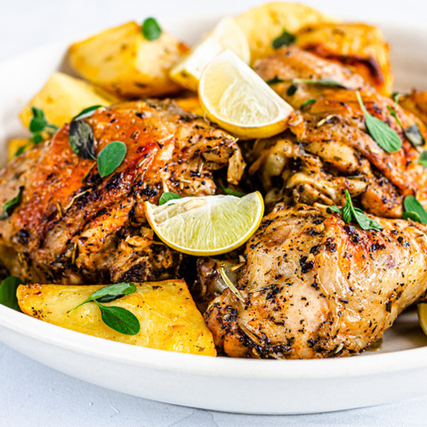 grilled chicken garnished with lemons on a white plate Grillers Gold Blog