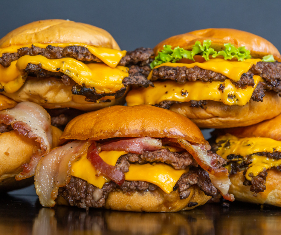 a tower of five smashburgers on top of each other