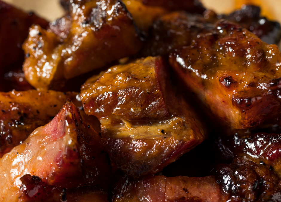 Sticky, hot honey pork belly burn ends close up